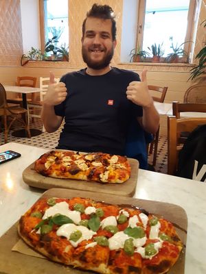 Incredible pizza. And my friend, who absolutely loves it here and is a frequent customer :D at Pizzeria Piccola in Ljubljana