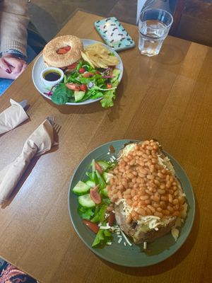 Jacket potato w/ cheese & beans (GF) and hummus & grilled pepper bagel  at Prosper in Ely