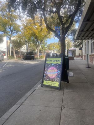 Upon Opening (9AM) Street Signage  at Cosmic Bakery  in Upland