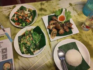 Pang cha vegetables, fried spring rolls, stir-fried kale and steamed rice at Spring Rolls Lanta in Koh Lanta