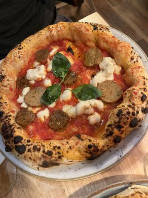 vegan margherita with extra vegan sausage   at Basils in Brussels