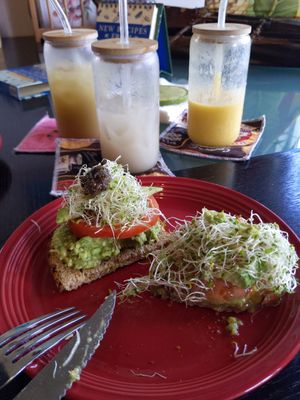 Avocado toast, two raw coffees, and a Hilo Sunrise smoothie. at Da Beans Green in Mountain View
