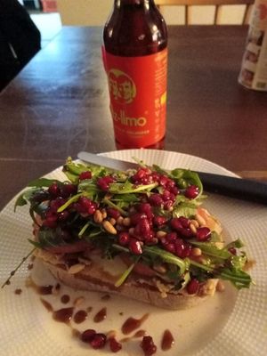 ciabatta with hummus, smoked tofu, rocket salad, pomegranade seeds, pine nuts at Café Jakubowski in Cologne