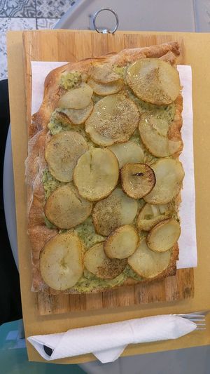 Pizza with slices potatoes, zuccini cream and pepper at Nonna Cleme in Turin