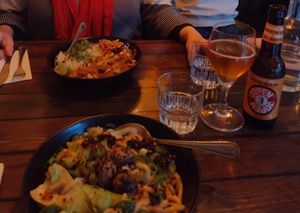 Ben ben noodles (front) & peanut butter curry (back) at SOIL Vegan Café - East in Amsterdam