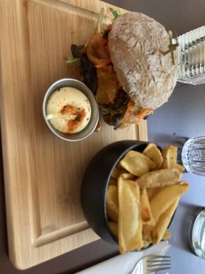Kimchi tempeh burger and fries  at SOIL Vegan Café - East in Amsterdam