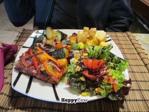 Vegan pizza plate at The Green Room Cafe. at The Green Room Cafe in Lisbon