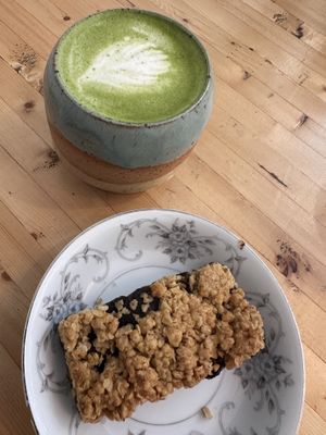 Very good date square with an oat milk matcha latte.  at Parlabas café-boutique in Quebec
