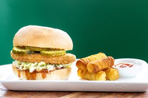 Chick'n Sandwich Combo: Meatless crispy chick'n cutlet (made from mushroom protein) on a vegan farmhouse roll with your choice of sauce and a side of potato croquettes or chips. at worldFLATS - Ridgewood in Ridgewood