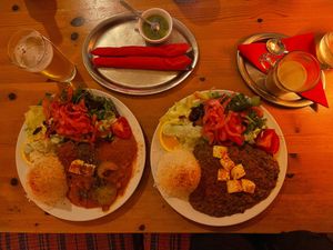 Pumpkin curry with salad, green chile sauce on the side, palik paneer with salad, homemade chai tea.  at tschüüüsch - plantpowered futurefood in Berlin