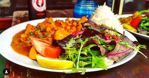 All currys are beautiful (ACAB) & all of them come with a mountain of basmati-rice & a deluxe-sidesalad. at tschüüüsch - plantpowered futurefood in Berlin