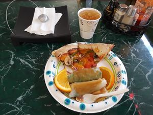 Pizza, spring rolls w/ peanut sauce, oranges, & sweet tea at Lotus Vegan Restaurant in Pinellas Park