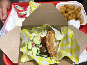 Meatball sandwich and tater tots. at Vegan Grill - Upper East Side in New York City