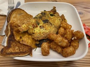 Just egg omelette with tomato, spinach and mushroom, with toast and tater tots  at Vegan Grill - Upper East Side in New York City