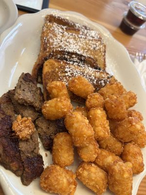 French toast with beyond sausage patty, tater tots   at Vegan Grill - Upper East Side in New York City