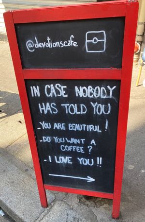 Cheesy but I love their sign  at Devotions Café in Paris