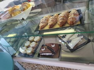 Cheesecake, almond-chocolate croissant, black forest cake, lemon tartlets at Fraise Café in Menton