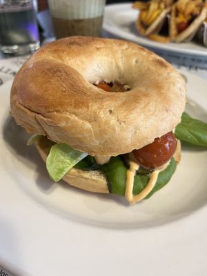 The boss bagel with tofu, salad, tomatoes and a spicy dressing   at La Desayunería  in Malaga