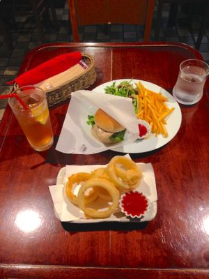 Onion rings, the Kyoto Miso Katsu burger with salad and fries, and a too-sweet-for-my-teeth housemate ginger ale.  at Matsuontoko Cafe in Kyoto