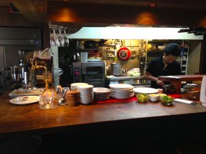 View of the counter and kitchen right next to the entrance.  at Matsuontoko Cafe in Kyoto