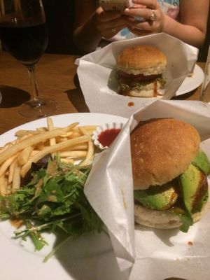 foreground avocado burger //bacgeound vegan burger at Matsuontoko Cafe in Kyoto
