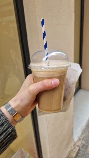 Iced latte with almond milk and two vegan cookies at Bertani Café in Malaga
