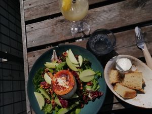 Goat’s cheese salad with homemade bread and vegan mayo and a ginger and lemon iced drink  at Tilstede mat og mer in Kristiansand