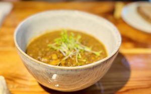 Lentil-pumpkin stew with homegrown tomatoes  at Das Jaartn in Berlin