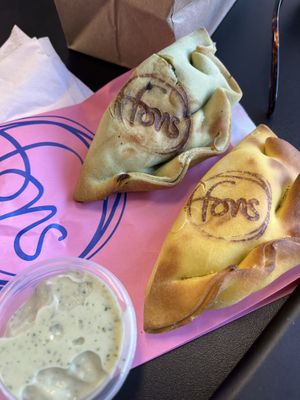 Smokey Mushroom up top was killer!!! The Tinga (bottom right corner) has Jackfruit and was pretty good. The sauce is their Garlic sauce and it accompanies both empanadas nicely.   at Fons in New York City