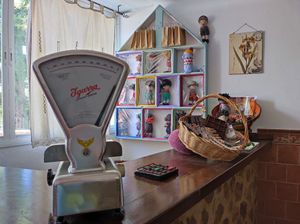 Gastroartesanía: artisan dolls made by Fatina, and the wooden house made by Geppeto. at VEGandVEG Gastroartesanía in Fuenteheridos