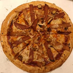 the ‘vegan feat pizza’ - meat free chicken, garlic sausage and pepperoni!  at Grove Cafe in Leeds