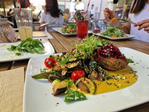 Wheat patty with veggies along in curry sauce at Velo Heilbronn in Heilbronn