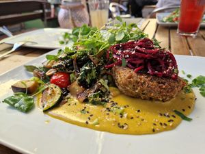 Wheat patty along with veggies in curry sauce at Velo Heilbronn in Heilbronn