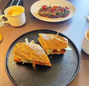 bahn mi and mushroom toast in the background   at Beyla in Copenhagen