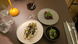 Asaragus over creme fraiche & gochujang wings with a cucumber lime side to balance heat at Beyla in Copenhagen