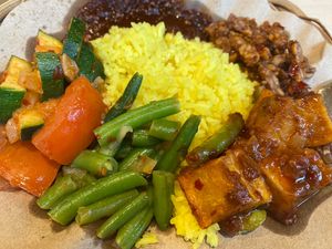 Nasi kuning with various vegan toppings   at Gembira in Maastricht