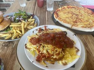 The burger, nachos and pizza (we requested it without veg).  at Taylor's Bar and Kitchen in Scarborough