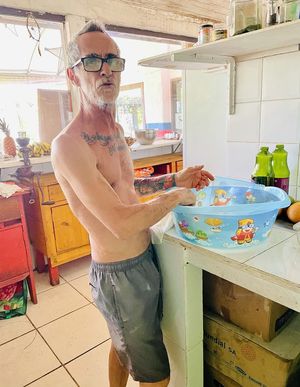 The owner and chef preparing food  at Vegano Carioca in Armacao Dos Buzios