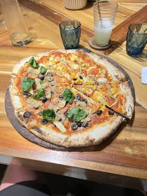Half and half the two vegan pizzas  at Gorgonzola Pizza & Pasta - El Nido in El Nido