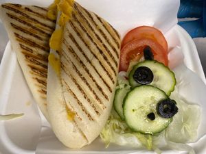 Vegan cheese and onion panini with salad  at Spud & Shakes in Glasgow