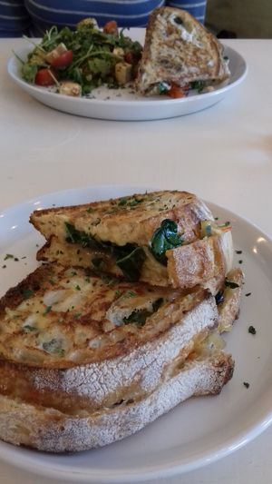 Sourdough toasties, with side salad on one plate at Culture - Cafe & Deli in Inverness