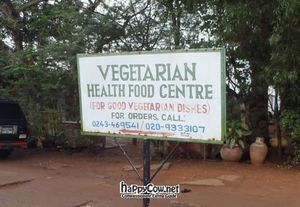 The sign for it off the road, keep an eye out for it! at Pat's Vegetarian Health Food Center in Accra