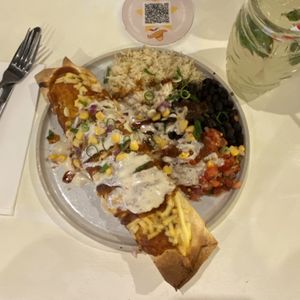 Overhead view of the vegan enchiladas and my mocktail (virgin mojito).  at Tres Mexican in Seaford