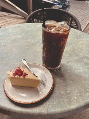 a vegan cheese cake covered with white chocolate at Moltto Coffee in Riga