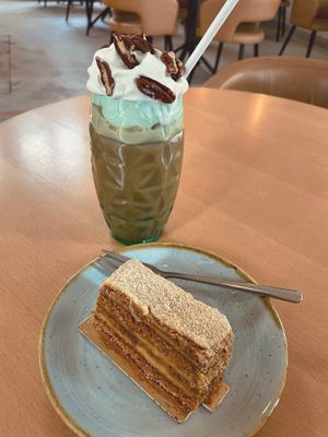 a lotus cake and a coffee-caramel-hazelnut-pecan drink with veg cream at Moltto Coffee in Riga