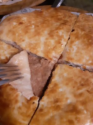 Vegan khachapuri with veg-meat at Saperavi Cafe in Moscow