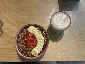 Smoothy bowl and cappuccino with oat milk  at JumpinGoat Coffee in Almaty
