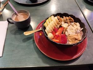 Las gachas y un café con leche vegetal at Ambrosía in Gijon