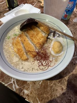 black garlic ramen with a vegan egg and a ramune in the back  at 7' Yen Sushi in Roseville