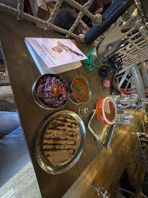 Chickpeas, slaw, roti, pomegranate fizz  at Mowgli in Glasgow